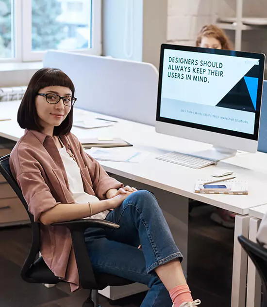 Girl sitting on chair with Mac